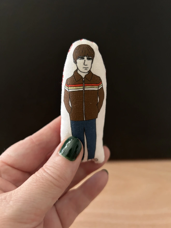 Mini illustrated fabric dolls of Oasis band member Noel Gallagher.