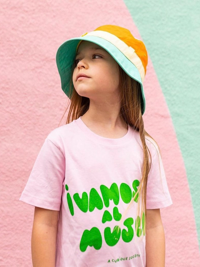 Girl wearing sun bucket hat in multi colour