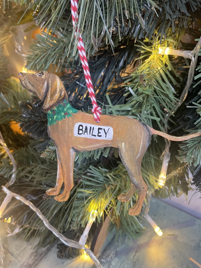 A  Vizsla dog Christmas decoration hanging from 