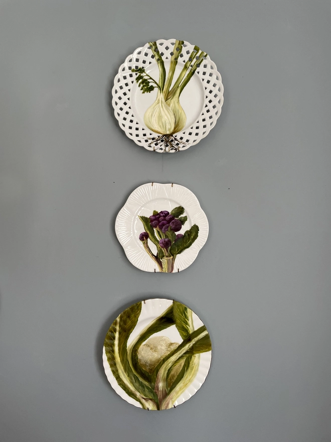 vegetable paintings on plates wall display