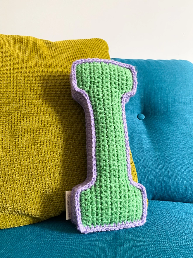 Crochet cushion shaped like the letter I in Sage Green and Lilac