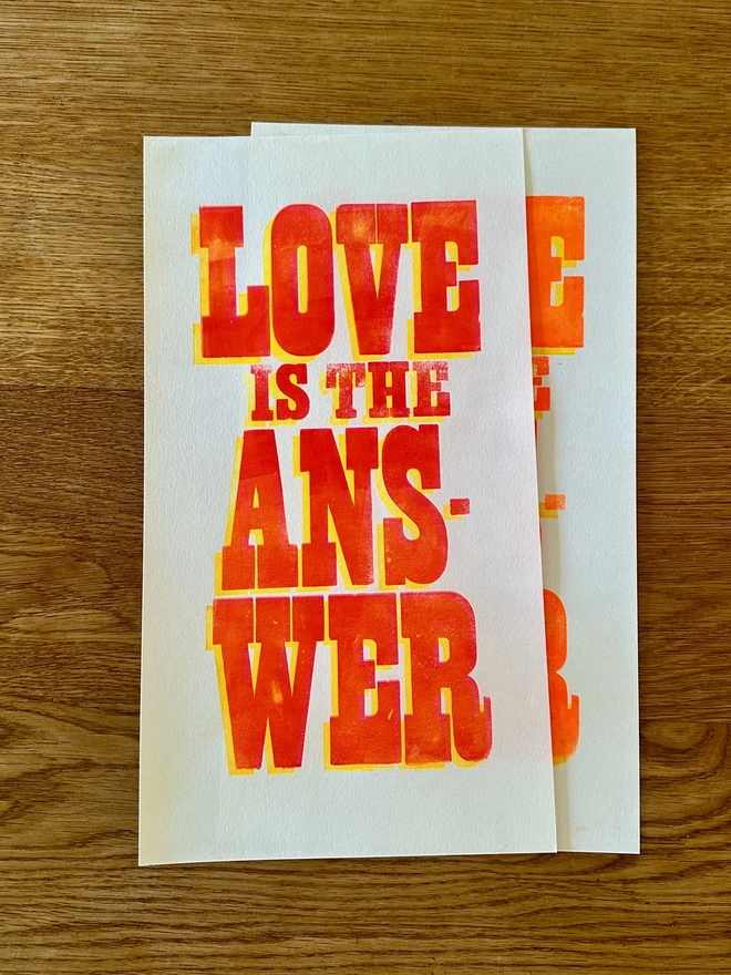 Two Love is the Answer Letterpress prints on wooden background