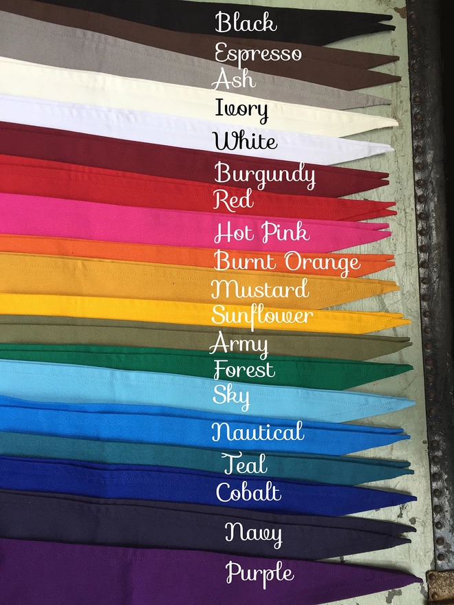 Different coloured pennants laid in a row.