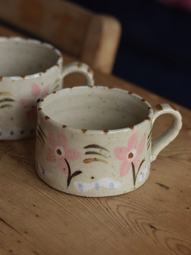 handmade ceramic mug with pink floral pattern 