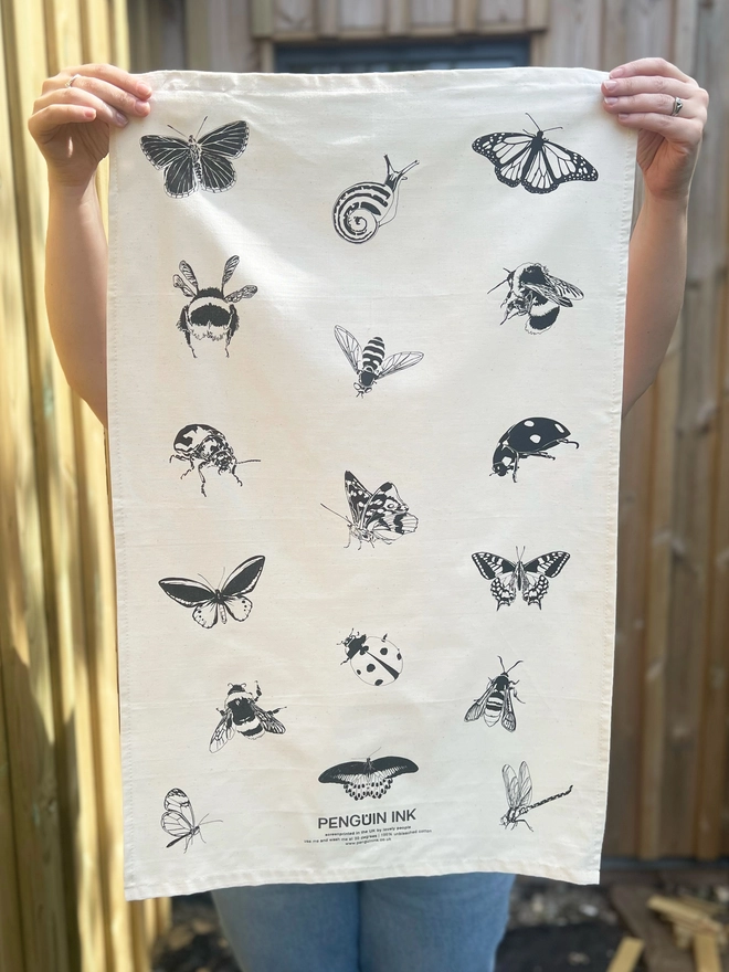 Hanging insect tea towel decorated with bees, butterflies, moths and a little snail