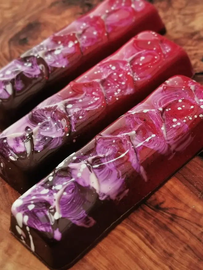 pink and purple chocolate bar with white paint splatter decor