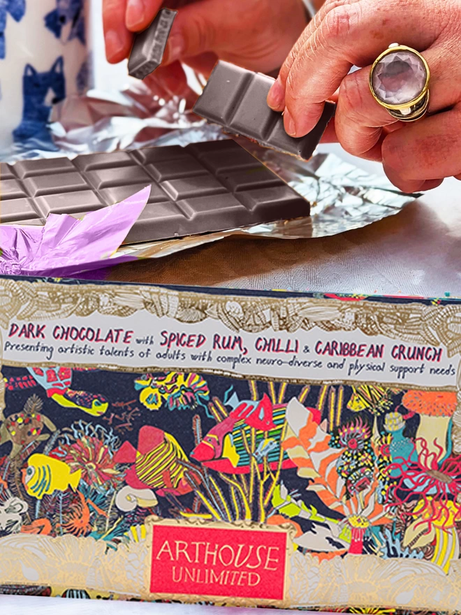 Charity dark chocolate with rum, chilli & caribbean crunch packaged in foiled card & fish drawings 