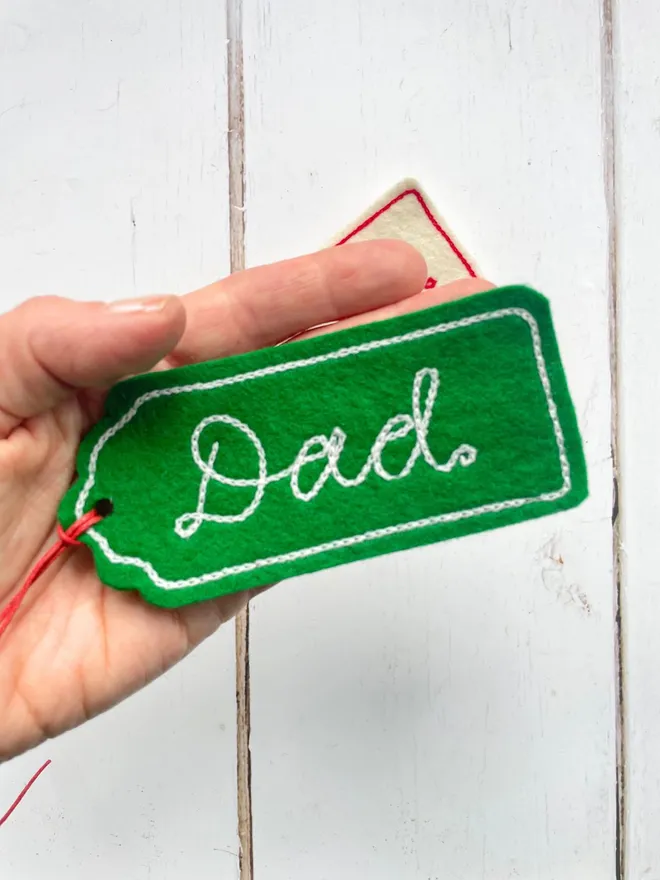 embroidered gift tag in green with the wording Dad