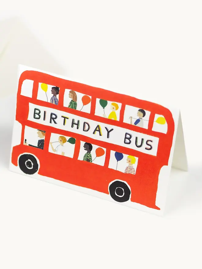 bright red bus card with birthday design and imagery