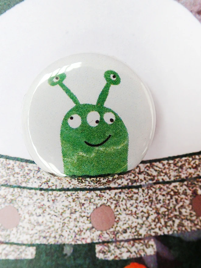 Pin badge with alien
