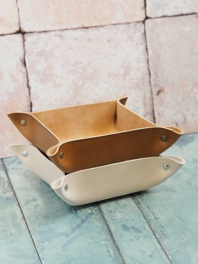Handmade leather valet tray. Two square leather trays, one hand dyed tan brown, the other natural cream. 