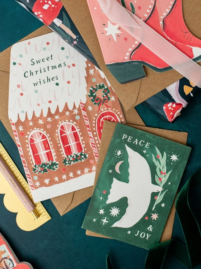 Gingerbread House Christmas Card styled with other Sister Paper Co greeting cards