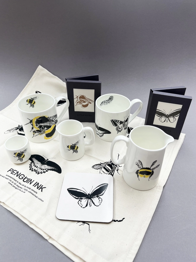 Group image, insect teatowel, bee mug, butterfly coasters and insect cards