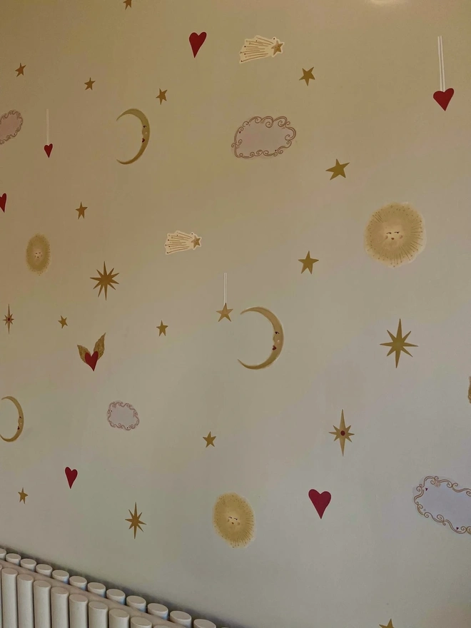 Celestial Dream Fabric Wall Stickers, a wall decorated with colourful wall stickers. 