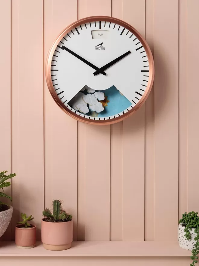 Bramwell Brown Clock seen on a pink wall.