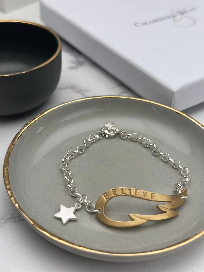 personalised gold wing charm bracelet on sterling silver chain with silver mini star charm