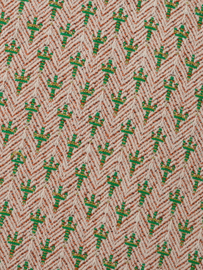 caoimhe cactus square cushion. a close up of cactus embroidery from a cushion.