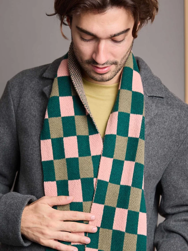 Green And Pink Patterned Wool Scarf Modelled By A Man In A Grey Coat