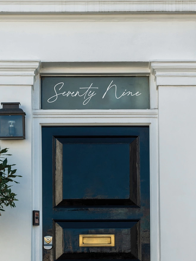 Handwritten Script, Front Door Number Sticker Decal in white on window above a black front door