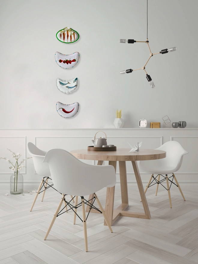decorated plates on white wall