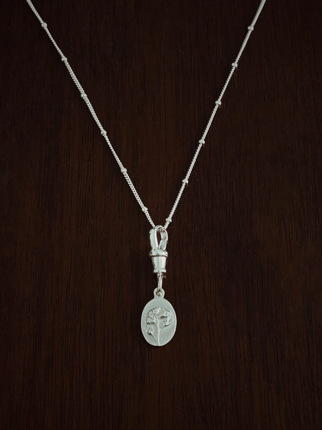 Forget me not medal charm with albert swivel clasp and curb satellite chain