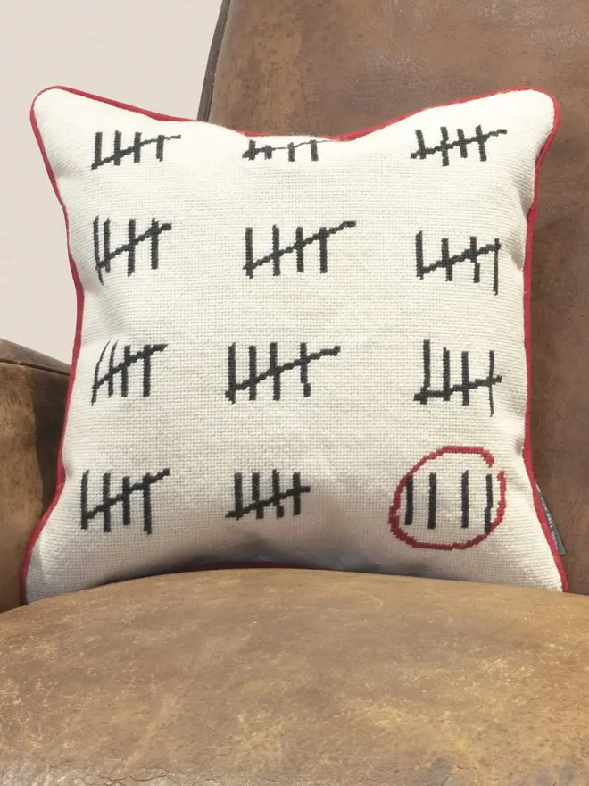 embroidered prison calendar cushion
