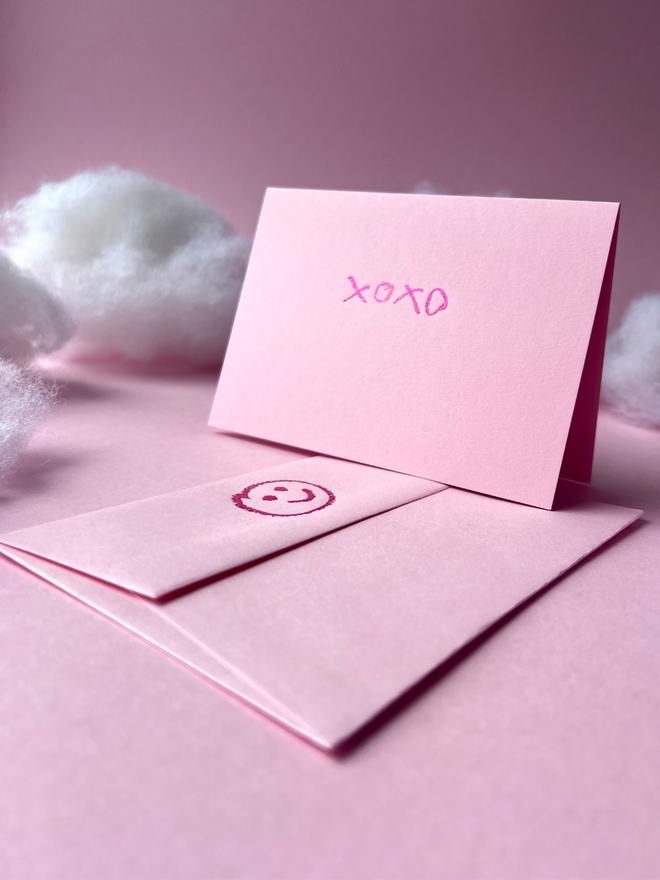 candy pink coloured card with xoxo hand foiled in kids hand writing
