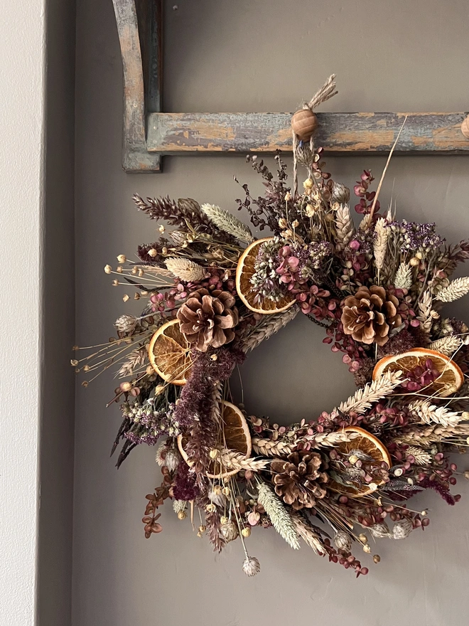 Cosy Winter wreath hanging on wall 