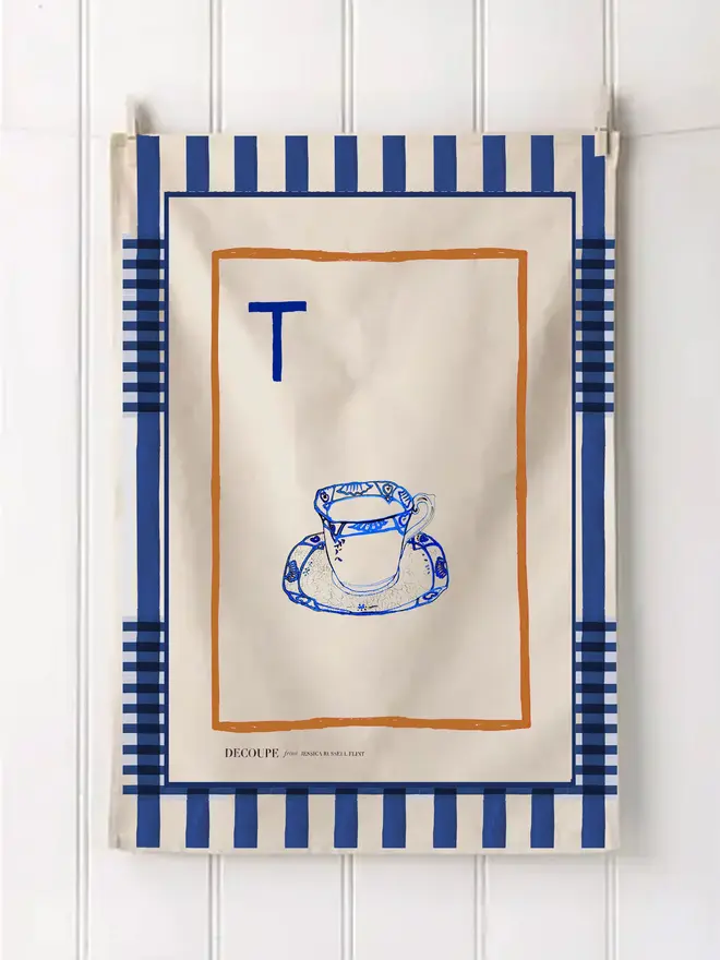 a-z alphabet tea towel. a tea towel with a tea cup print and the letter 't' in the corner.