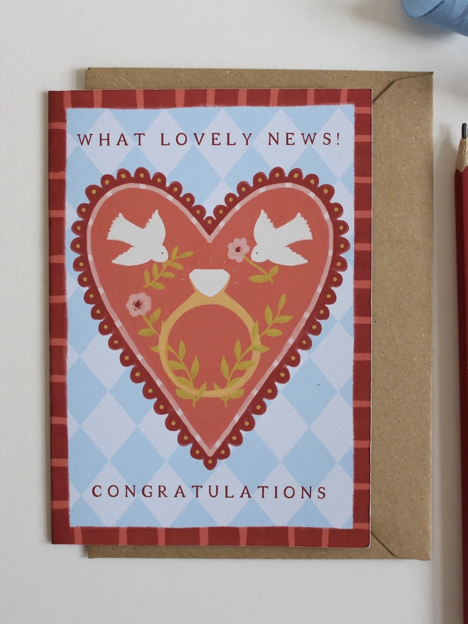 botanical engagement card featuring love birds on a big heart with a ring