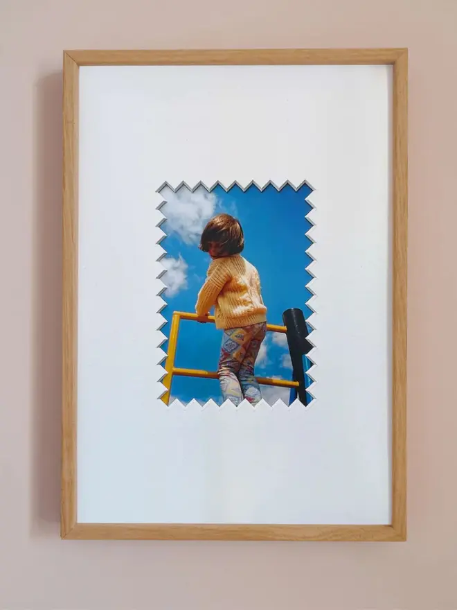 Ziggy photo mount frame ,displaying a centered portrait photo, hung on a neutral beige wall.