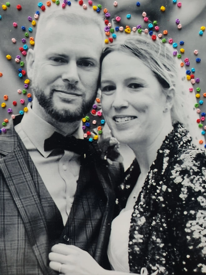  Close up image of wedding photo in B&W with hand embroidered french knot confetti