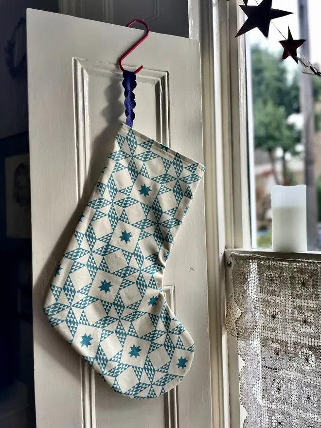 Celest Organic Printed Stocking, hanging. 