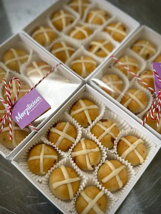 Marzipan Hot Cross Buns (Box Of 6 Or 9), groups of marzipan hot cross buns packaged in white boxes. 