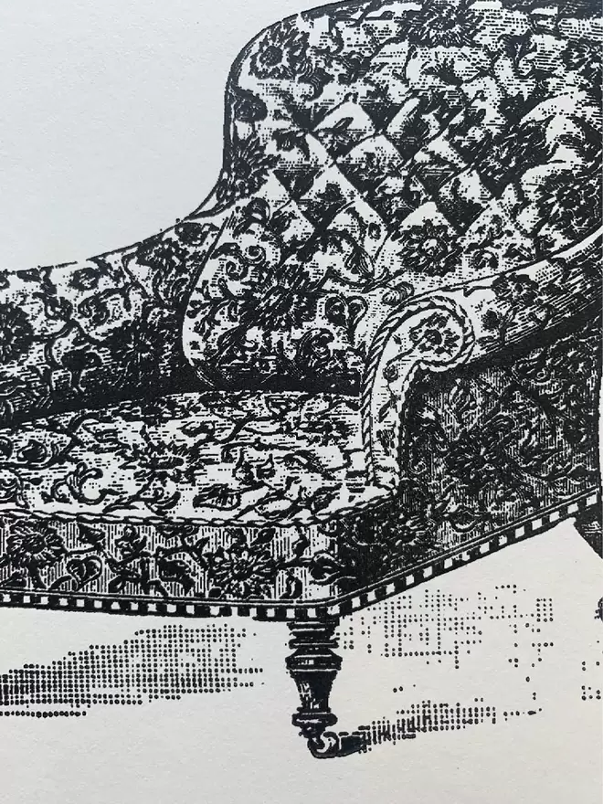A black and white printed illustration of a chair.