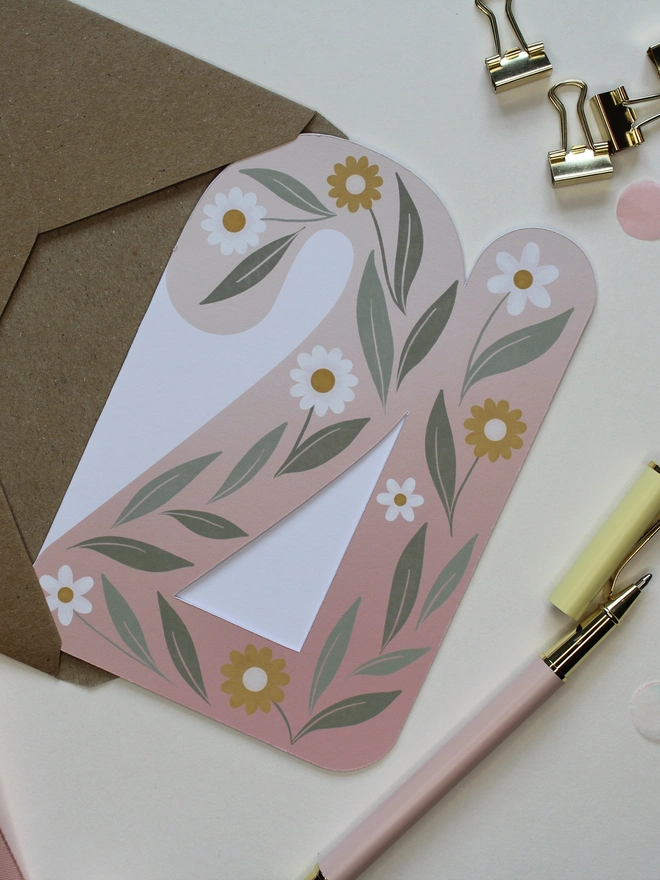 floral 21st birthday card. card shaped like number 21 with illustrated flowers and leaves.