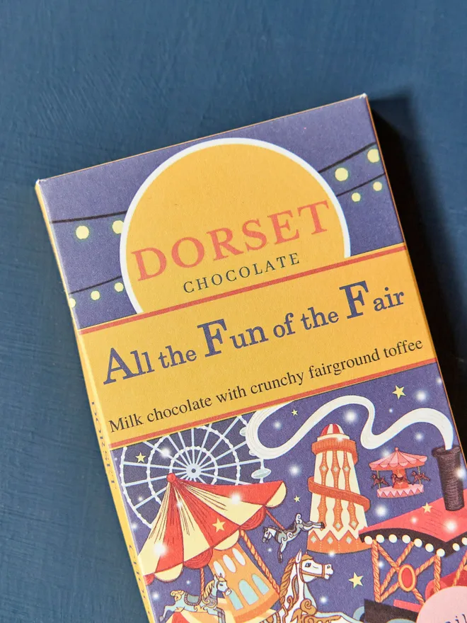 chocolate bar with 'all the fun of the fair' title and fairground illustrations