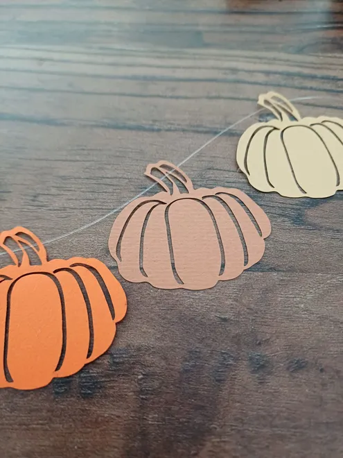 Three colours of pumpkin decoration: orange, cinnamon and honey brown