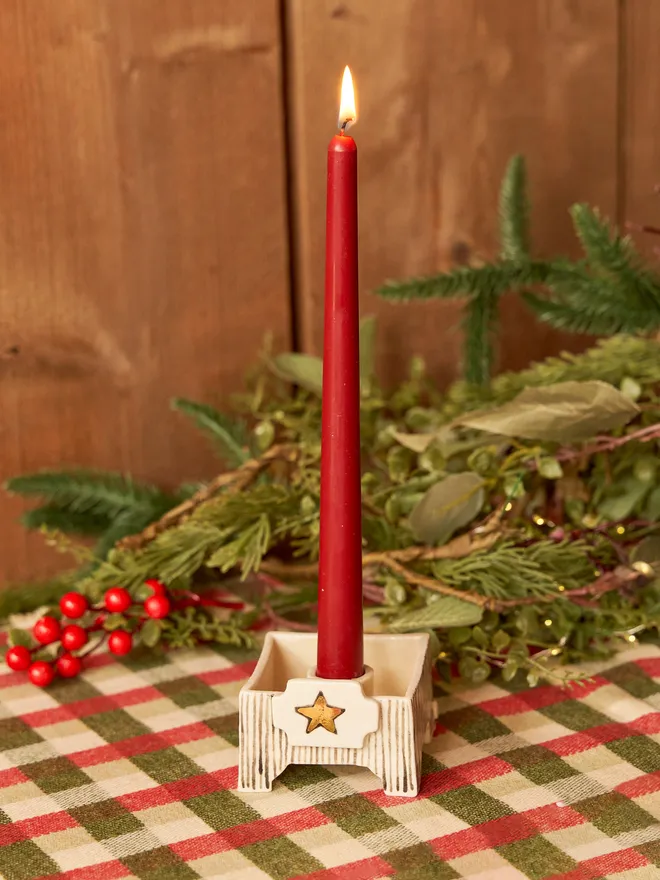 square star candle holder being held