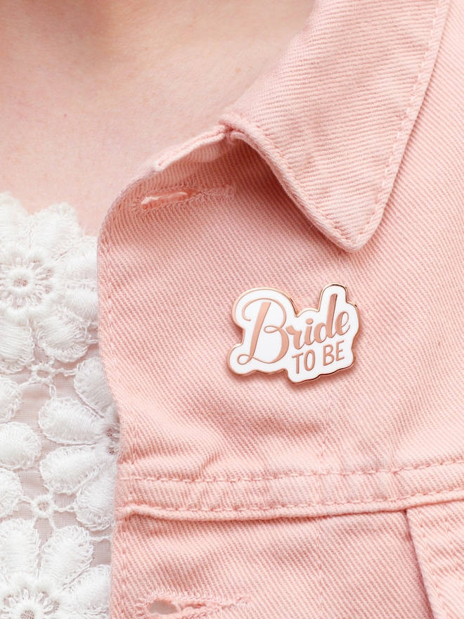 bride to be enamel pin badge on pink denim jacket