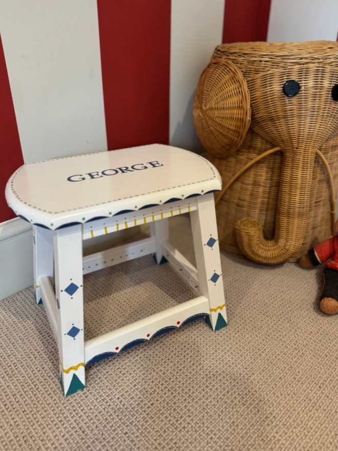 George Personalised Children’s Stool. A white and blue stool with intricate scalloping pattern.