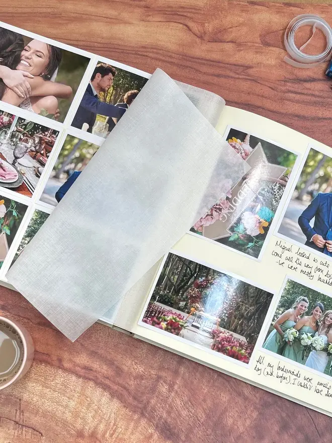Large 'Jewel' Hardback Photo Album with plain cover, opened to show photos inside, resting on a wooden table.