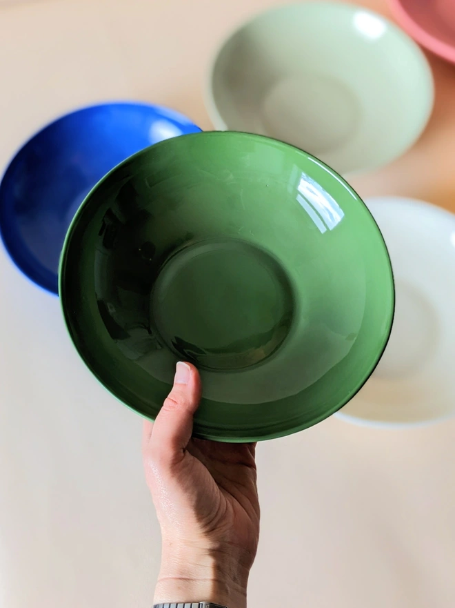 Glossy Glazed Inside of Porcelain Hand Made Pasta Bowl in Dark Angelica Green Held in Hand