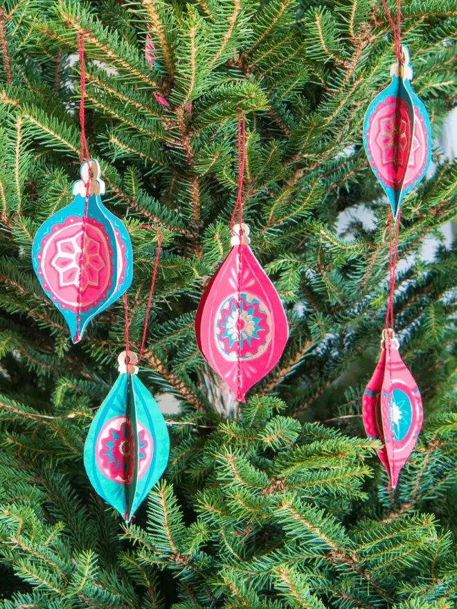 Christmas bauble paper decorations hanging on Christmas tree