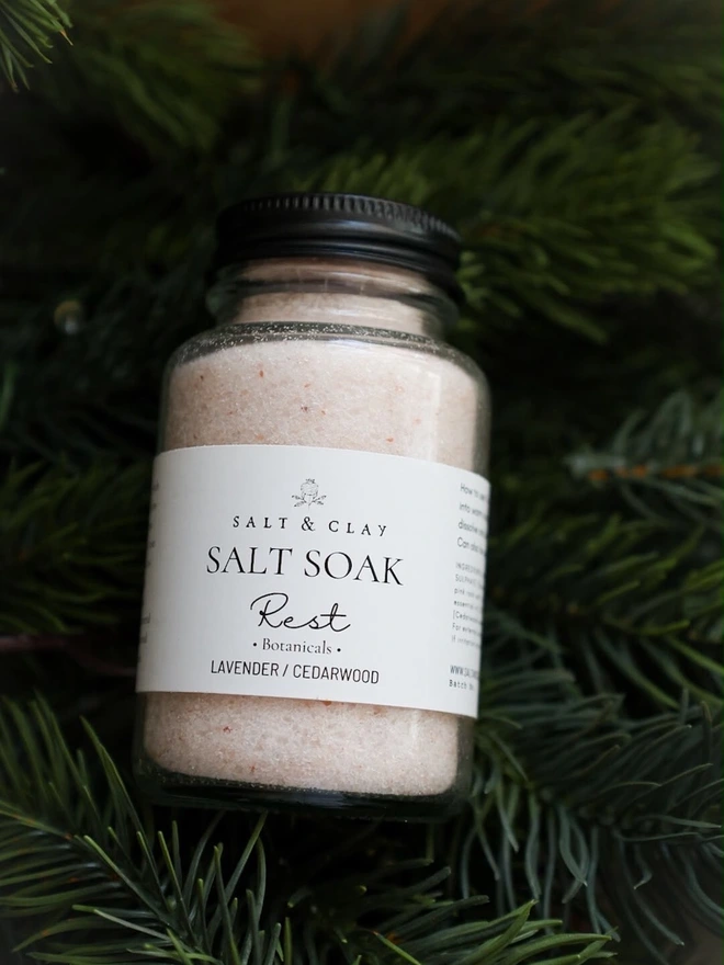 A jar of bath salts blended with Lavender and Cedarwood essential oils.