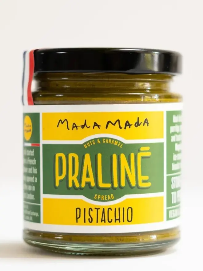 Pistachio Praline Spread, against a white background. 
