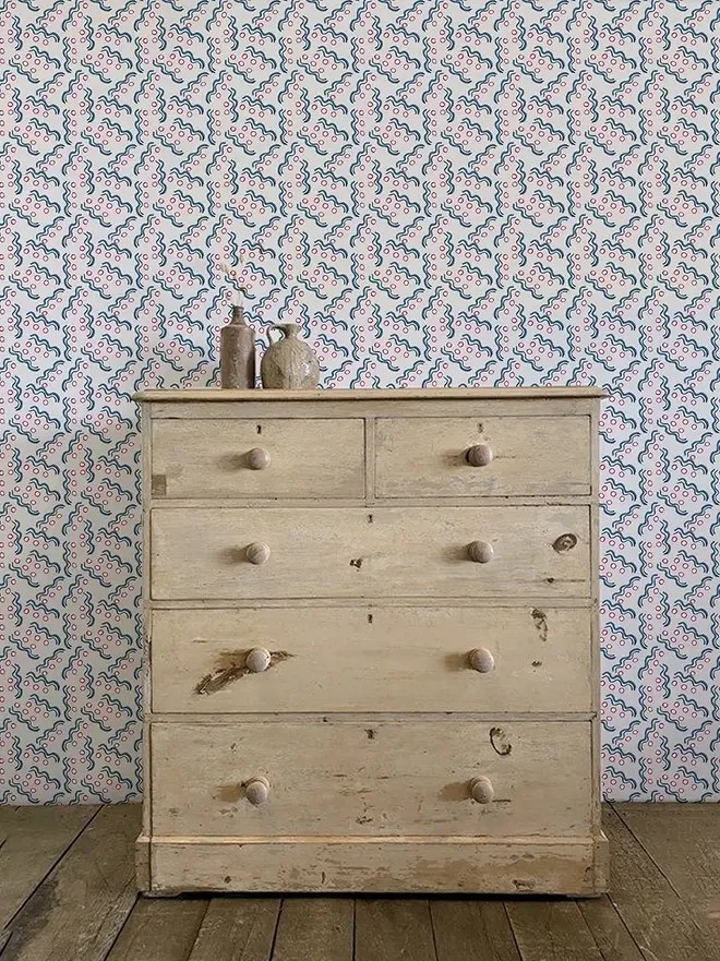 hoop and wiggle illustrated wall paper. a white background wallpaper patterned with blue circles and squiggly lines.