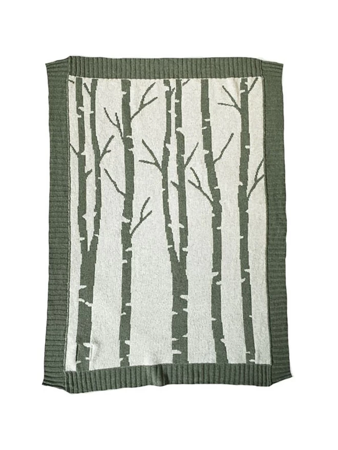 Product shot of the reverse colourway of the birch forest baby blanket, paler green background with moss green tree design.