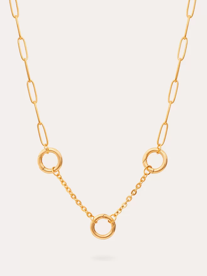 still life of a triple link heavy mixed gold chain necklace