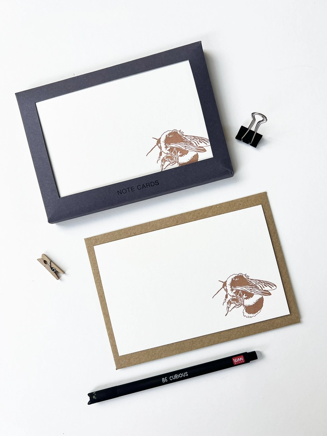 Boxed flat correspondence cards illustrated with a bumble bee